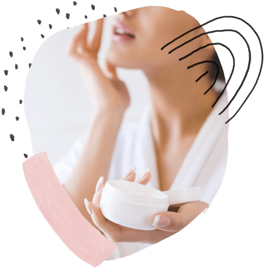 a woman holding a cream container