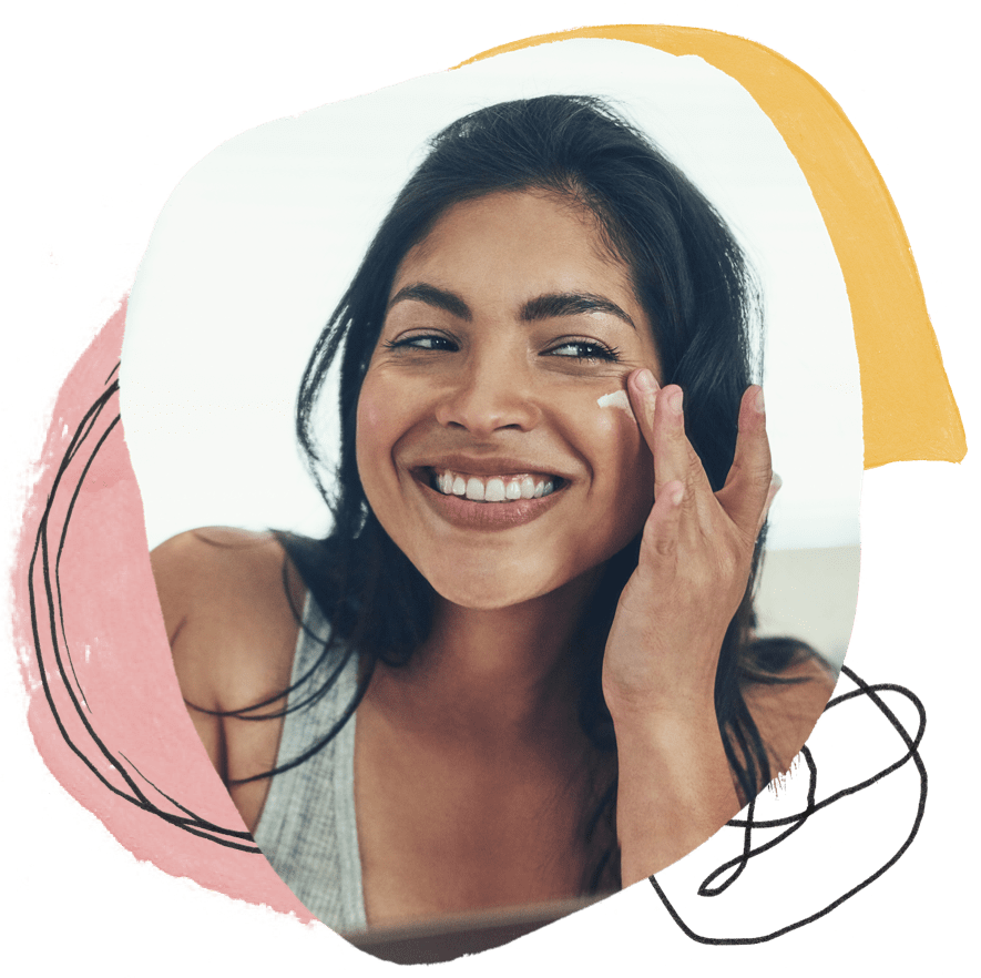a woman applying cream on her face