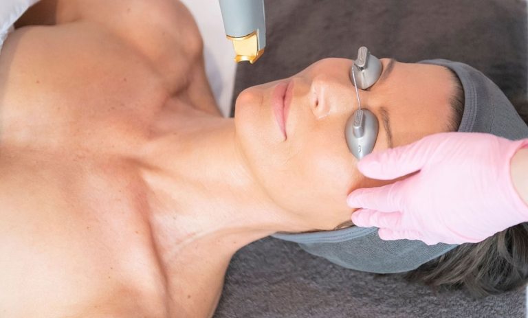 Dermal Clinician preforming laser treatment
