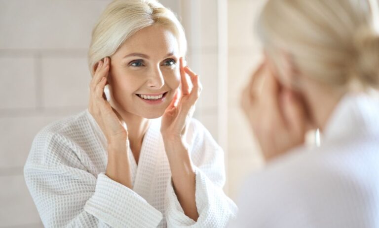 Mature woman looking in the mirror