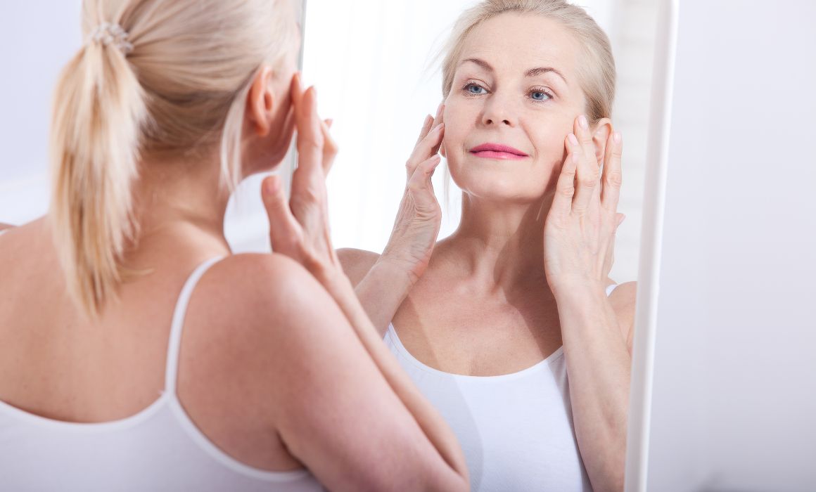 a woman touching her face