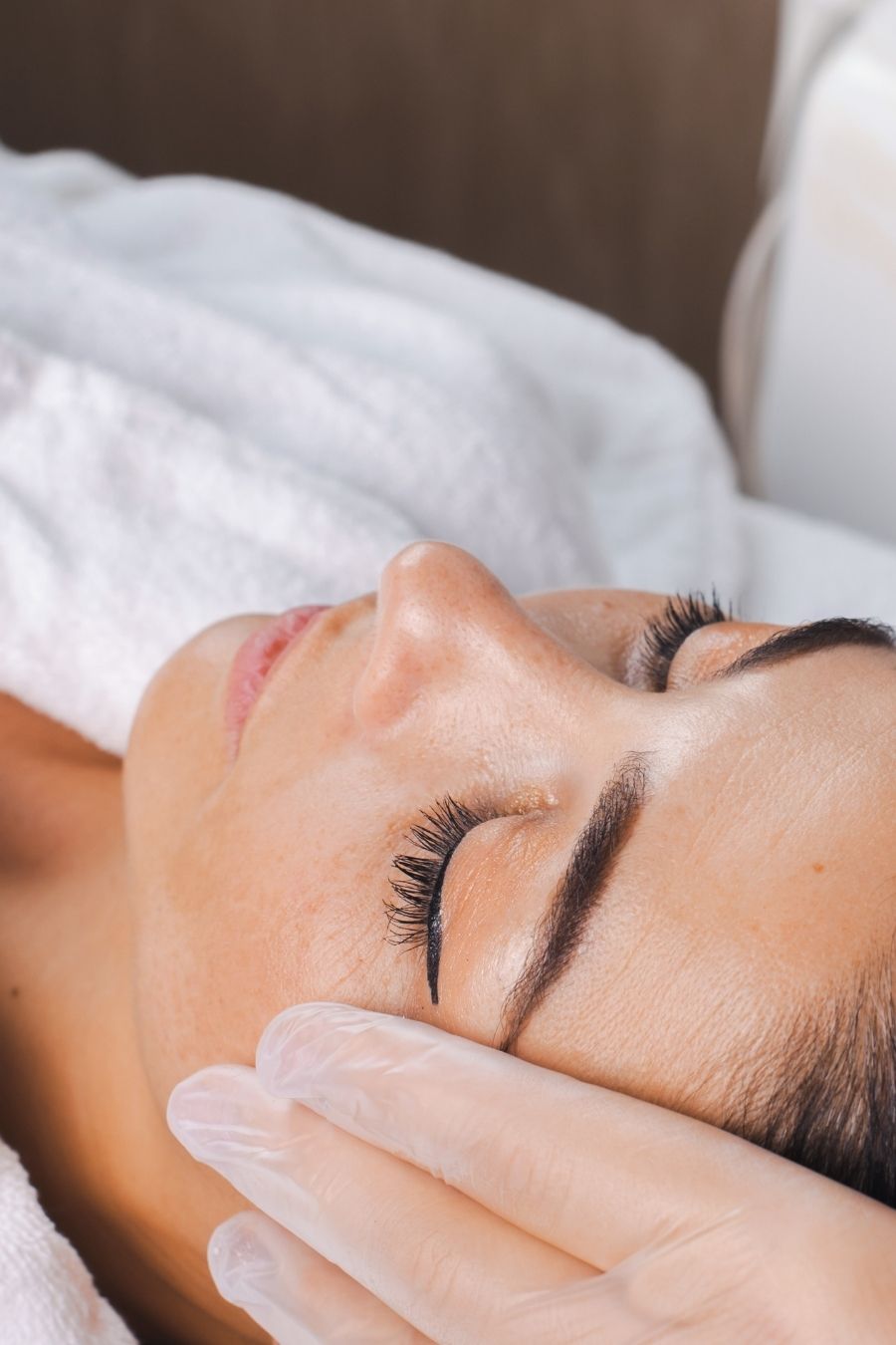 Close up of woman's face receiving BBL treatment